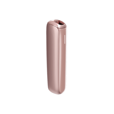 Ploom AURA Rose Gold device on a table during a coffee break.